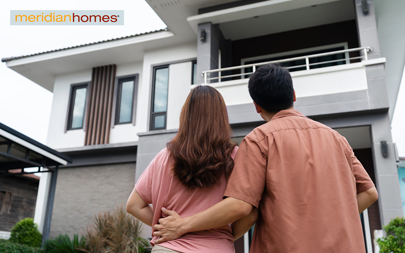 Couple looking at their newly remodeled house
