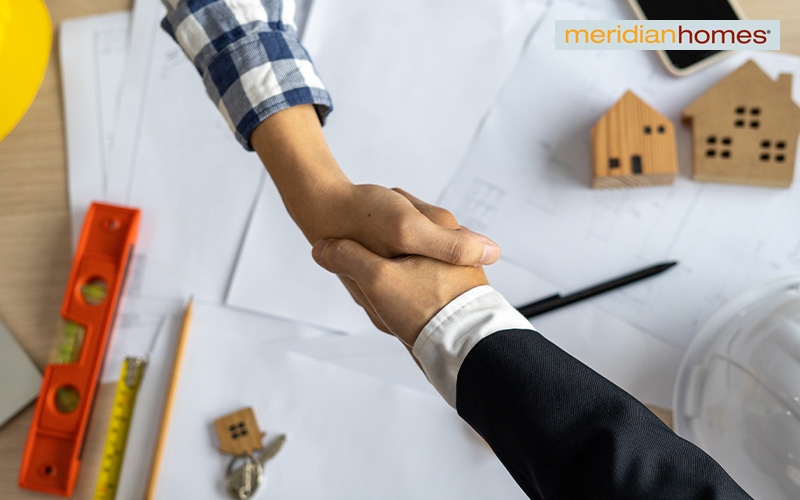 Contractor and client shaking hands